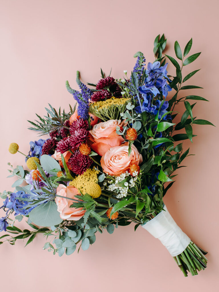 peach Flat Lay Background with brides bouqet