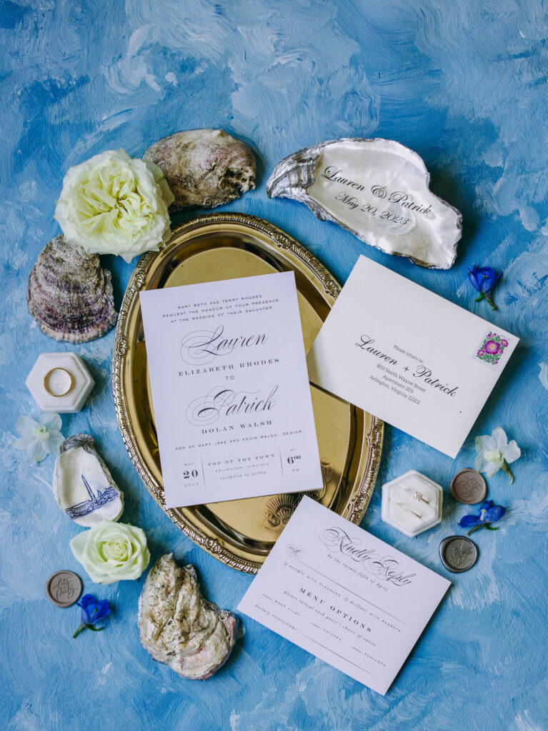 wedding flat lay with painted light blue background from lindale studios